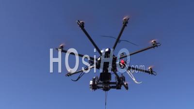 Octocopter Drone With Camera Flying Down Rapidly